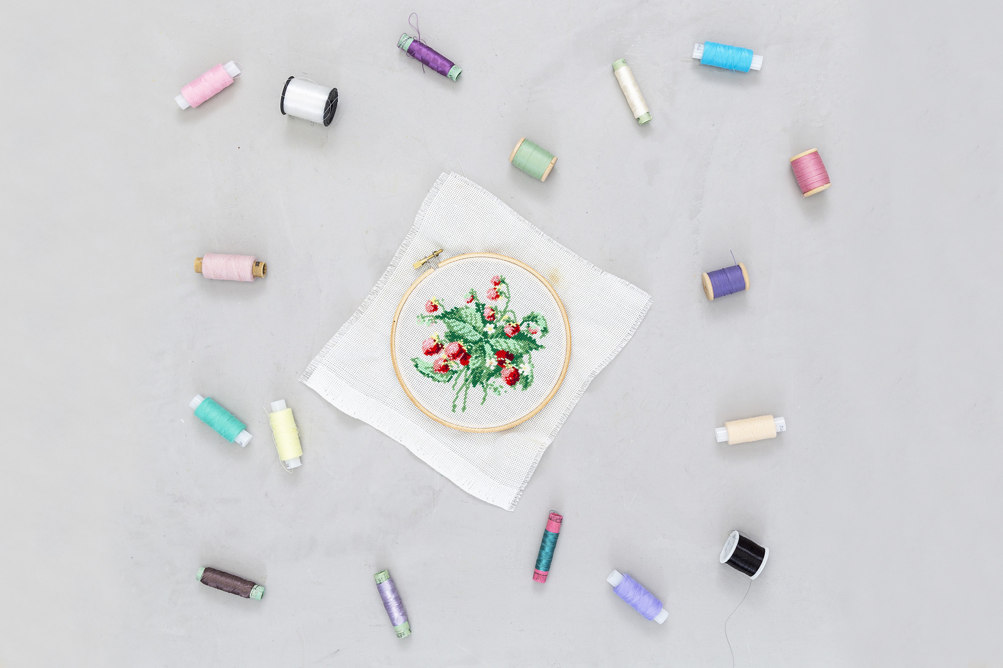 Selection of finished embroidery samples on table